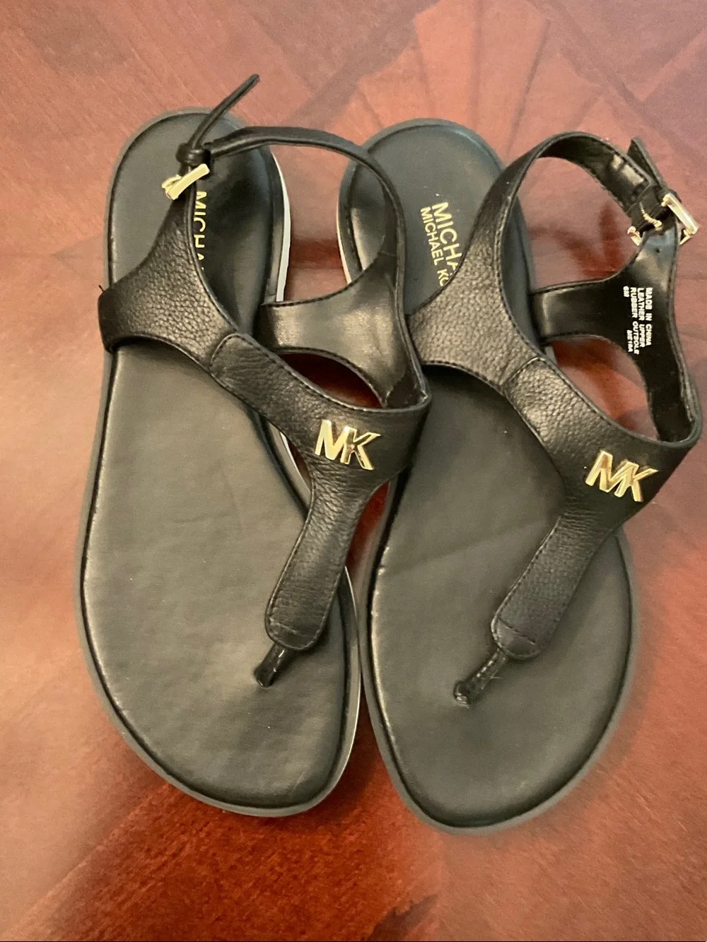 Michael Kors Black Thong Sandals with Gold MK Hardware